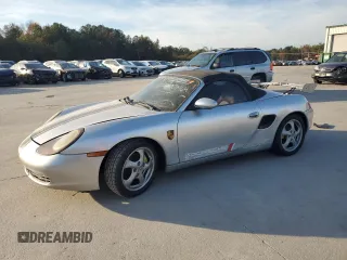 1998 Porsche Boxster z VIN WP0CA2987WS620369, wystawiony jako Copart lot #81003964 z przebiegiem Nie podano mil oraz Szkoda całkowita • Salvage title. Historia ofert i sprzedaży dostępna na DreamBid. Obrazek 1.