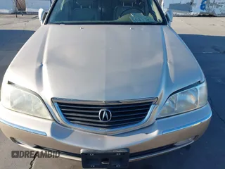 1999 Acura RL with VIN JH4KA9661XC005883, listed as a IAAI auction lot 40560595 with 165,195 mi miles. Bid and sale history available at carsss.com. Image 6.