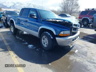 2003 Dodge Dakota SLT with VIN 1D7HL48N73S333828, listed as a IAAI auction lot 41748642 with 163,258 mi miles. Bid and sale history available at carsss.com. Image 1.