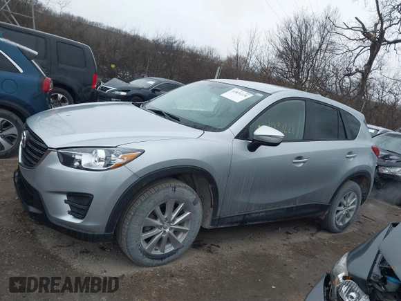 2016 Mazda CX-5 Sport with VIN JM3KE2BY5G0647715, listed as a IAAI auction lot 41831228 with 89,689 mi miles and . Bid and sale history available at DreamBid. Image 14.