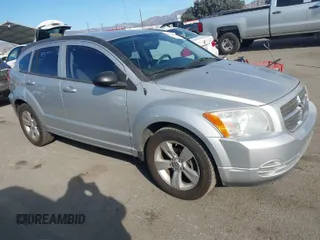 2010 Dodge Caliber SXT with VIN 1B3CB4HA3AD664526, listed as a IAAI auction lot 41401694 with 215,104 mi miles and . Bid and sale history available at DreamBid. Image 1.
