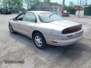 1999 Oldsmobile Aurora z VIN 1G3GR62C5X4114285, wystawiony jako IAAI lot #42271517 z przebiegiem 308 731 mil mil oraz . Historia ofert i sprzedaży dostępna na DreamBid. Obrazek 3.