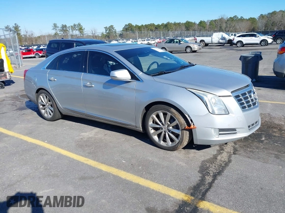 2013 Cadillac XTS Premium z VIN 2G61S5S35D9209252, wystawiony jako IAAI lot #41275066 z przebiegiem 132 311 mil mil oraz . Historia ofert i sprzedaży dostępna na DreamBid. Obrazek 1.