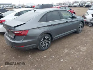 2021 Volkswagen Jetta SEL z VIN 3VWE57BU5MM086681, wystawiony jako IAAI lot #41832830 z przebiegiem 37 398 mil mil oraz . Historia ofert i sprzedaży dostępna na DreamBid. Obrazek 4.