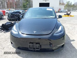 2022 Tesla Model Y Performance with VIN 7SAYGDEF7NF310113, listed as a IAAI auction lot 42038407 with 46,052 mi miles and . Bid and sale history available at DreamBid. Image 13.