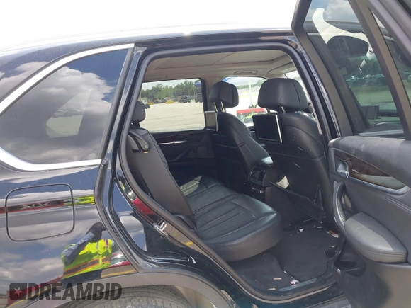 2016 BMW X5 xDrive50i with VIN 5UXKR6C51G0J81658, listed as a IAAI auction lot 41801382 with 34,572 mi miles. Bid and sale history available at carsss.com. Image 8.
