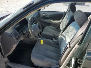 2000 Toyota Corolla VE with VIN 1NXBR12E5YZ387383, listed as a Copart auction lot 78931374 with 162,008 mi miles and Salvage title. Bid and sale history available at DreamBid. Image 7.