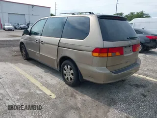 2004 Honda Odyssey EX-L z VIN 5FNRL18954B014748, wystawiony jako IAAI lot #42389048 z przebiegiem 136 176 mil mil oraz . Historia ofert i sprzedaży dostępna na DreamBid. Obrazek 3.