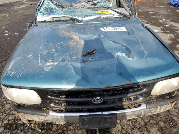 1994 Mazda B-Series Truck LE z VIN 4F4DR17X5RTN10704, wystawiony jako Copart lot #87230804 z przebiegiem 227 476 mil mil oraz Szkoda całkowita • Salvage title. Historia ofert i sprzedaży dostępna na DreamBid. Obrazek 12.