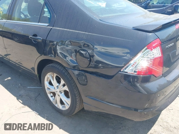 2012 Ford Fusion SE z VIN 3FAHP0HA5CR241364, wystawiony jako IAAI lot #42388912 z przebiegiem 130 126 mil mil oraz . Historia ofert i sprzedaży dostępna na DreamBid. Obrazek 6.