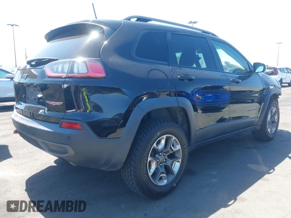 2019 Jeep Cherokee Trailhawk with VIN 1C4PJMBXXKD433284, listed as a IAAI auction lot 42020051 with 57,089 mi miles and . Bid and sale history available at DreamBid. Image 4.