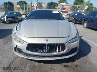 2014 Maserati Ghibli S Q4 with VIN ZAM57RTA8E1095303, listed as a IAAI auction lot 41600587 with 98,215 mi miles. Bid and sale history available at carsss.com. Image 12.