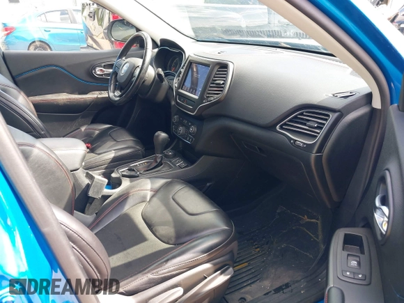 2020 Jeep Cherokee Trailhawk with VIN 1C4PJMBXXLD636547, listed as a IAAI auction lot 42314654 with 59,061 mi miles and . Bid and sale history available at DreamBid. Image 5.