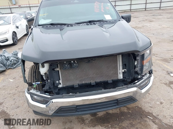 2023 Ford F-150 XL with VIN 1FTMF1C50PKE33412, listed as a IAAI auction lot 41391359 with 19,344 mi miles and . Bid and sale history available at carsss.com. Image 6.