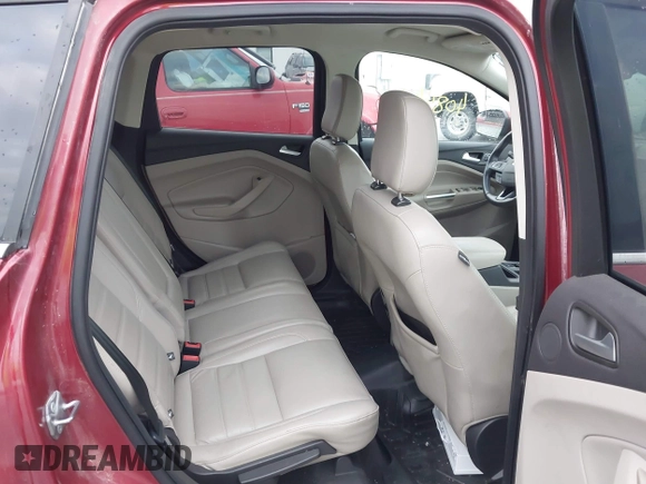 2019 Ford Escape Titanium z VIN 1FMCU9J99KUA18880, wystawiony jako IAAI lot #40830436 z przebiegiem 117 499 mil mil oraz . Historia ofert i sprzedaży dostępna na DreamBid. Obrazek 8.