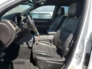 2014 Jeep Grand Cherokee Overland with VIN 1C4RJFCT7EC105296, listed as a Copart auction lot 50822775 with 180,067 mi miles and Salvage Title. Bid and sale history available at DreamBid. Image 7.