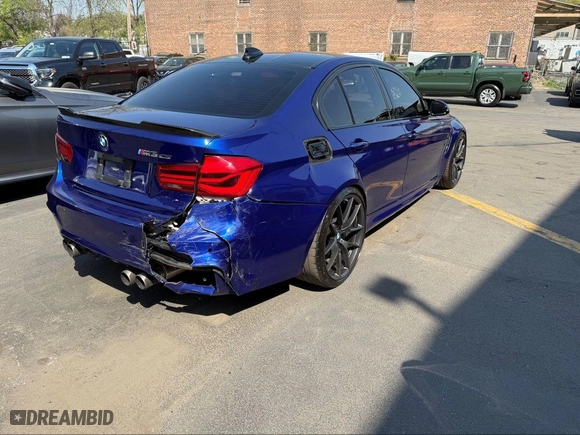 2018 BMW M3 with VIN WBS8M9C59J5L71951, listed as a IAAI auction lot 42129203 with 50,011 mi miles. Bid and sale history available at carsss.com. Image 4.