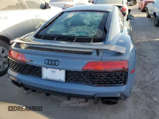 2022 Audi R8 z VIN WUAKBAFX5N7901301, wystawiony jako Copart lot #76451354 z przebiegiem Nie podano mil oraz Nie do naprawy • Non repairable. Historia ofert i sprzedaży dostępna na DreamBid. Obrazek 6.