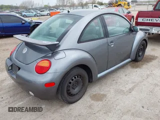 2004 Volkswagen New Beetle Coupe GL with VIN 3VWBK31C24M404429, listed as a IAAI auction lot 42041721 with 189,443 mi miles. Bid and sale history available at carsss.com. Image 4.