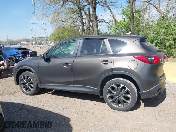 2016 Mazda CX-5 Grand Touring z VIN JM3KE4DY8G0846265, wystawiony jako IAAI lot #42102843 z przebiegiem 159 827 mil mil oraz . Historia ofert i sprzedaży dostępna na DreamBid. Obrazek 14.