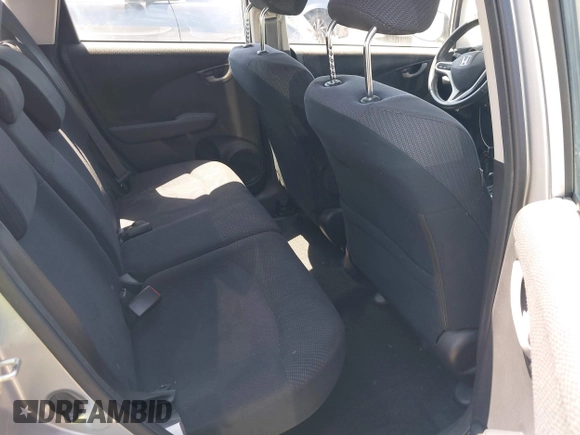 2013 Honda Fit Sport z VIN JHMGE8H56DC009996, wystawiony jako IAAI lot #42349929 z przebiegiem 152 779 mil mil oraz . Historia ofert i sprzedaży dostępna na DreamBid. Obrazek 8.