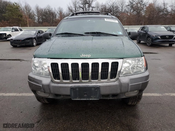 1999 Jeep Grand Cherokee Laredo with VIN 1J4GW58N0XC684111, listed as a Copart auction lot 85944784 with 128,741 mi miles and Salvage Title. Bid and sale history available at carsss.com. Image 5.