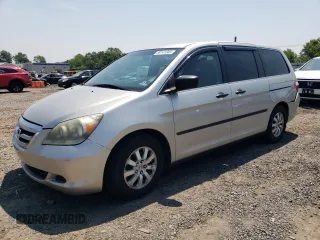 2007 Honda Odyssey LX with VIN 5FNRL38287B054504, listed as a Copart auction lot 59141665 with 128,617 mi miles and Salvage title. Bid and sale history available at DreamBid. Image 1.