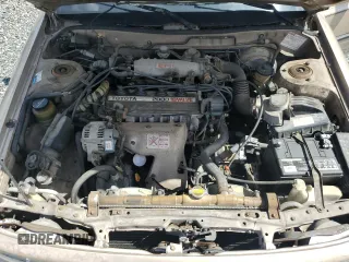 1991 Toyota Camry DLX z VIN 4T1SV21E5MU415356, wystawiony jako Copart lot #74465914 z przebiegiem 74 592 mil mil oraz Szkoda całkowita • Salvage title. Historia ofert i sprzedaży dostępna na DreamBid. Obrazek 11.