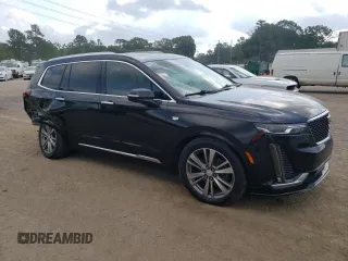 2020 Cadillac XT6 FWD Premium Luxury with VIN 1GYKPCRS6LZ102682, listed as a Copart auction lot 56906645 with 76,884 mi miles and Salvage title. Bid and sale history available at DreamBid. Image 4.