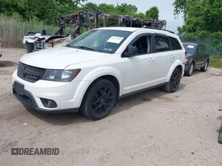 2014 Dodge Journey SXT z VIN 3C4PDCBBXET135001, wystawiony jako IAAI lot #42318360 z przebiegiem 152 321 mil mil oraz . Historia ofert i sprzedaży dostępna na DreamBid. Obrazek 2.