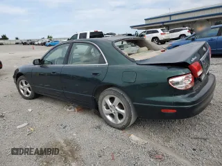 2001 Mazda Millenia z VIN JM1TA221011708952, wystawiony jako Copart lot #64995014 z przebiegiem Nie podano mil oraz Szkody całkowita. Historia ofert i sprzedaży dostępna na DreamBid. Obrazek 2.