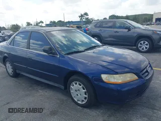 2002 Honda Accord LX z VIN JHMCG56482C014034, wystawiony jako IAAI lot #42110164 z przebiegiem 95 657 mil mil oraz . Historia ofert i sprzedaży dostępna na DreamBid. Obrazek 1.