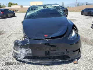 2022 Tesla Model Y Performance z VIN 7SAYGDEF0NF540933, wystawiony jako Copart lot #56087145 z przebiegiem 59 717 mil mil oraz Szkoda całkowita • Salvage title. Historia ofert i sprzedaży dostępna na DreamBid. Obrazek 5.