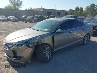 2016 Lincoln MKZ z VIN 3LN6L2GK9GR601143, wystawiony jako IAAI lot #42690132 z przebiegiem 155 073 mil mil oraz . Historia ofert i sprzedaży dostępna na DreamBid. Obrazek 2.