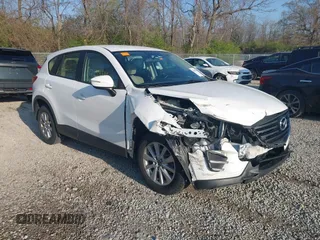 2016 Mazda CX-5 Sport with VIN JM3KE2BY2G0819604, listed as a IAAI auction lot 42059846 with 124,911 mi miles. Bid and sale history available at carsss.com. Image 1.