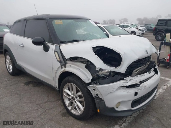 2014 MINI Cooper Paceman S with VIN WMWSS5C5XEWN67230, listed as a IAAI auction lot 41669156 with 108931 miles. Bid and sale history available at carsss.com. Image 1.