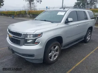 2015 Chevrolet Tahoe LT with VIN 1GNSCBKC5FR121069, listed as a IAAI auction lot 41799529 with 216,869 mi miles. Bid and sale history available at carsss.com. Image 2.