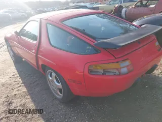 1989 Porsche 928 z VIN WP0JB0921KS860712, wystawiony jako IAAI lot #41497719 z przebiegiem Nie podano mil oraz . Historia ofert i sprzedaży dostępna na DreamBid. Obrazek 3.