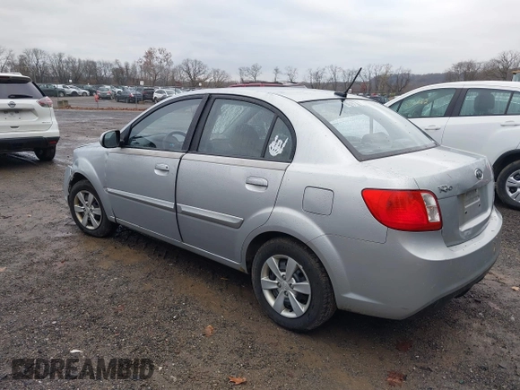 2010 Kia Rio LX with VIN KNADH4A37A6645279, listed as a IAAI auction lot 40856780 with 165,385 mi miles. Bid and sale history available at carsss.com. Image 3.