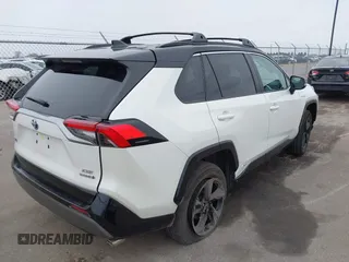 2021 Toyota RAV4 Hybrid XSE with VIN 2T3E6RFV4MW021009, listed as a IAAI auction lot 41940278 with 33,016 mi miles and . Bid and sale history available at DreamBid. Image 4.