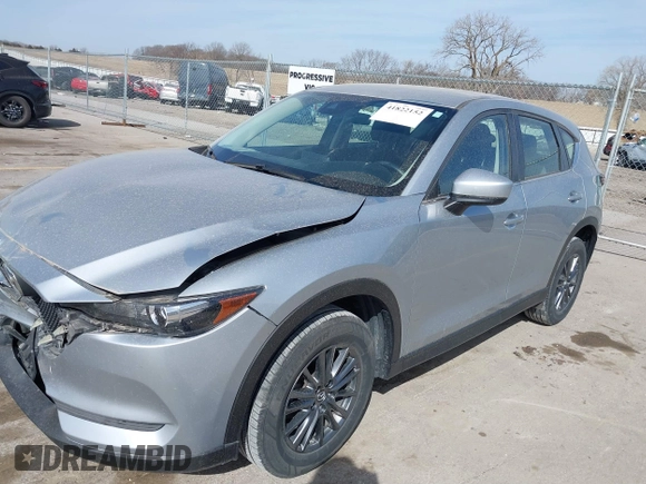 2019 Mazda CX-5 Sport with VIN JM3KFBBM6K1582760, listed as a IAAI auction lot 41822152 with 60,620 mi miles and . Bid and sale history available at DreamBid. Image 17.