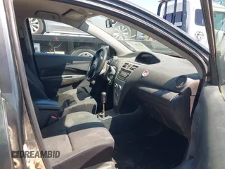 2009 Toyota Yaris with VIN JTDBT903891349784, listed as a IAAI auction lot 42135557 with 244,107 mi miles. Bid and sale history available at carsss.com. Image 5.