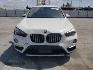 2018 BMW X1 xDrive28i with VIN WBXHT3C35J5L26952, listed as a Copart auction lot 51715035 with 63,306 mi miles and Salvage Title. Bid and sale history available at carsss.com. Image 5.