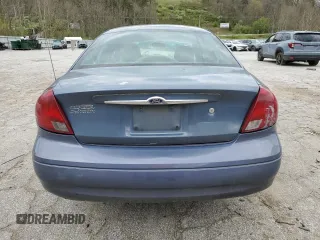 2000 Ford Taurus SE z VIN 1FAFP53U5YA259273, wystawiony jako Copart lot #52787305 z przebiegiem 234 848 mil mil oraz Szkoda całkowita • Salvage title. Historia ofert i sprzedaży dostępna na DreamBid. Obrazek 6.
