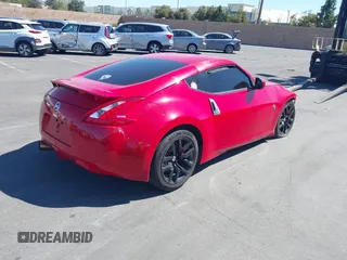 2014 Nissan 370Z Nismo with VIN JN1AZ4EH9EM636306, listed as a IAAI auction lot 41467766 with 101,021 mi miles and . Bid and sale history available at DreamBid. Image 4.