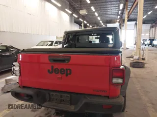 2020 Jeep Gladiator Sport S z VIN 1C6HJTAGXLL125496, wystawiony jako IAAI lot #41749633 z przebiegiem 56 203 mil mil oraz . Historia ofert i sprzedaży dostępna na DreamBid. Obrazek 16.