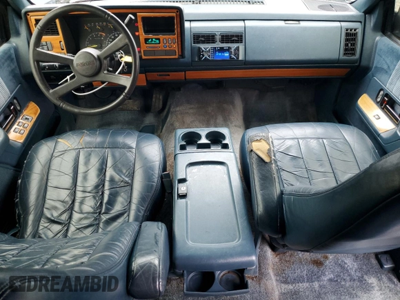 1994 GMC Suburban z VIN 1GKEC16K4RJ762562, wystawiony jako Copart lot #81242184 z przebiegiem 182 583 mil mil oraz Szkoda całkowita • Salvage title. Historia ofert i sprzedaży dostępna na DreamBid. Obrazek 8.