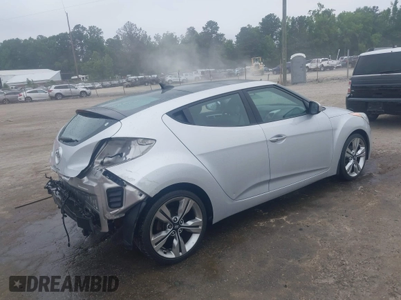 2012 Hyundai Veloster w/Black Int with VIN KMHTC6AD1CU034787, listed as a IAAI auction lot 42607847 with 126,912 mi miles and . Bid and sale history available at DreamBid. Image 4.