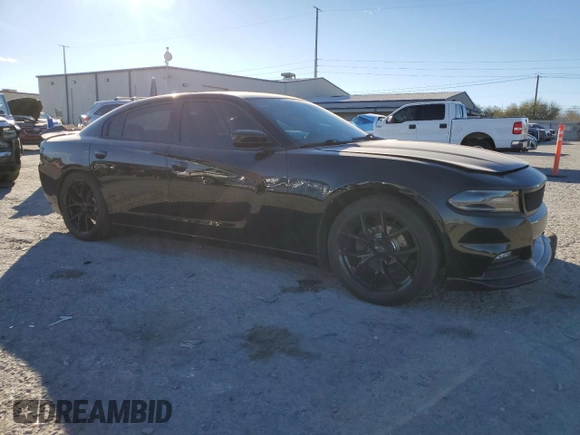 2015 Dodge Charger SXT with VIN 2C3CDXHG8FH769883, listed as a Copart auction lot 87723825 with 81,859 mi miles and Salvage Title. Bid and sale history available at DreamBid. Image 4.