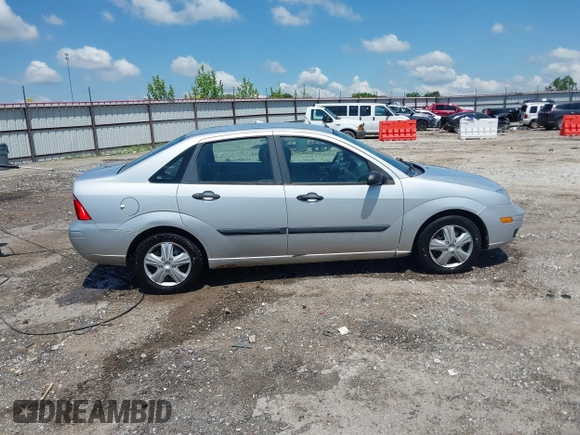 2007 Ford Focus S z VIN 1FAFP34N57W109953, wystawiony jako IAAI lot #42225399 z przebiegiem Nie podano mil oraz . Historia ofert i sprzedaży dostępna na DreamBid. Obrazek 13.